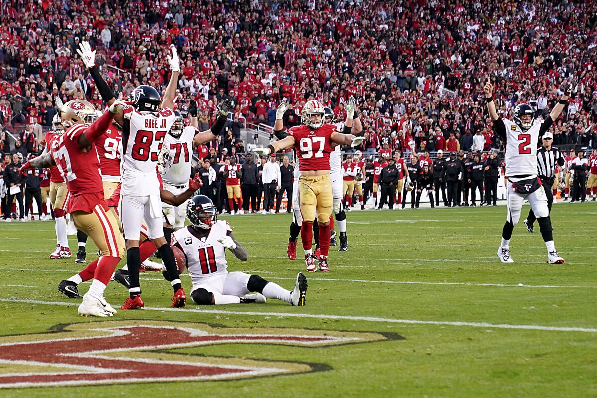 Atlanta Falcons quarterback Matt Ryan celebrates after connecting with wide receiver Julio Jones on a touchdown pass.