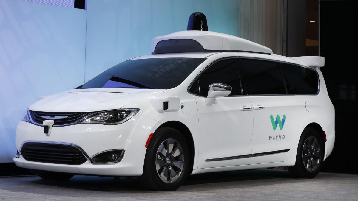 A Chrysler Pacifica hybrid is outfitted with Waymo's suite of sensors and radar.
