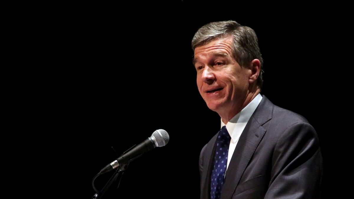 North Carolina Democratic Gov. Roy Cooper challenged a Republican-backed law that changed how elections are organized and managed in the state.