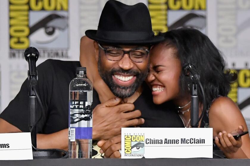 SAN DIEGO, CA - JULY 21: Cress Williams (L) and China Anne McClain speak onstage at the "Black Lightning" Special Video Presentation and Q&A during Comic-Con International 2018 at San Diego Convention Center on July 21, 2018 in San Diego, California. (Photo by Mike Coppola/Getty Images) ** OUTS - ELSENT, FPG, CM - OUTS * NM, PH, VA if sourced by CT, LA or MoD **