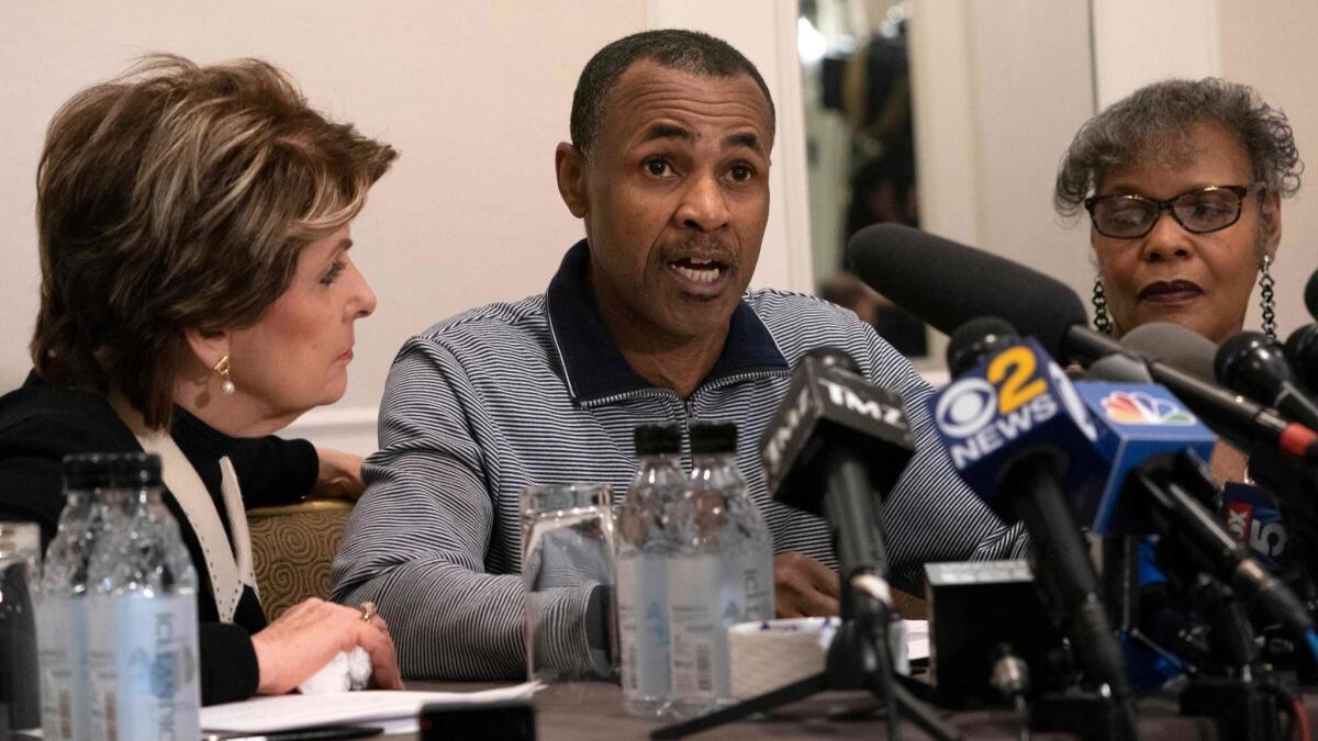 Gary Dennis, who found video allegedly showing R. Kelly abusing girls, speaks at a news conference alongside attorney Gloria Allred, left, and his wife, Sallie.