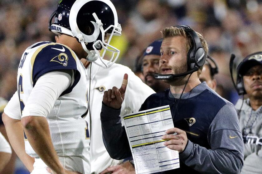 LOS ANGELES, CA - JANUARY 6, 2018:Los Angeles Rams head coach Sean McVay talks with Los Angeles Rams quarterback Jared Goff (16) in the first half of the first round of the NFL playoffs at the Memorial Coliseum on January 6, 2018 in Los Angeles, California.(Gina Ferazzi / Los Angeles Times)