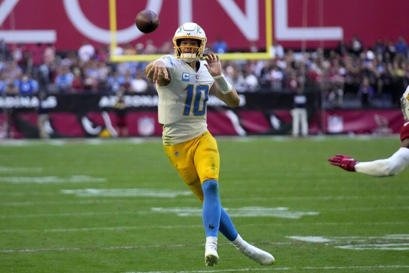 Los Angeles Chargers quarterback Justin Herbert (10) throws against the Arizona Cardinals during the second half of an NFL football game, Sunday, Nov. 27, 2022, in Glendale, Ariz. (AP Photo/Rick Scuteri)
