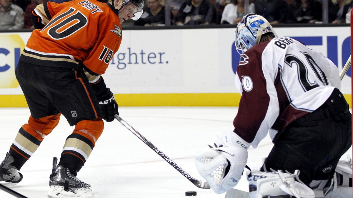 Ducks right wing Corey Perry (10) has a shot stopped by Avalanche goalie Reto Berra in the second period Friday night in Anaheim.