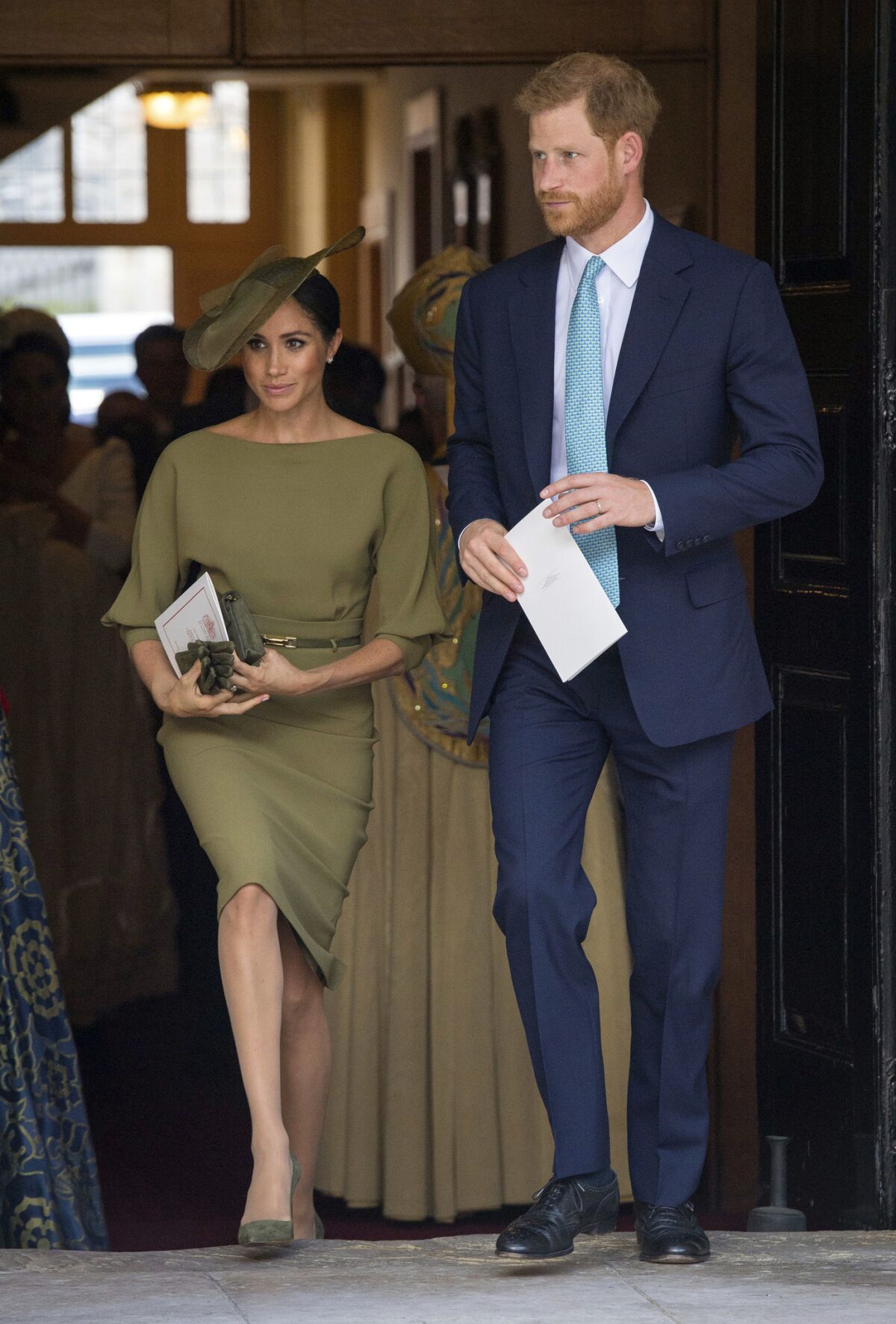 Britain's Prince Harry and Meghan, Duchess of Sussex leave after attending the christening service of Prince Louis at the Chapel Royal, St. James' Palace, London, Monday, July 9, 2018.