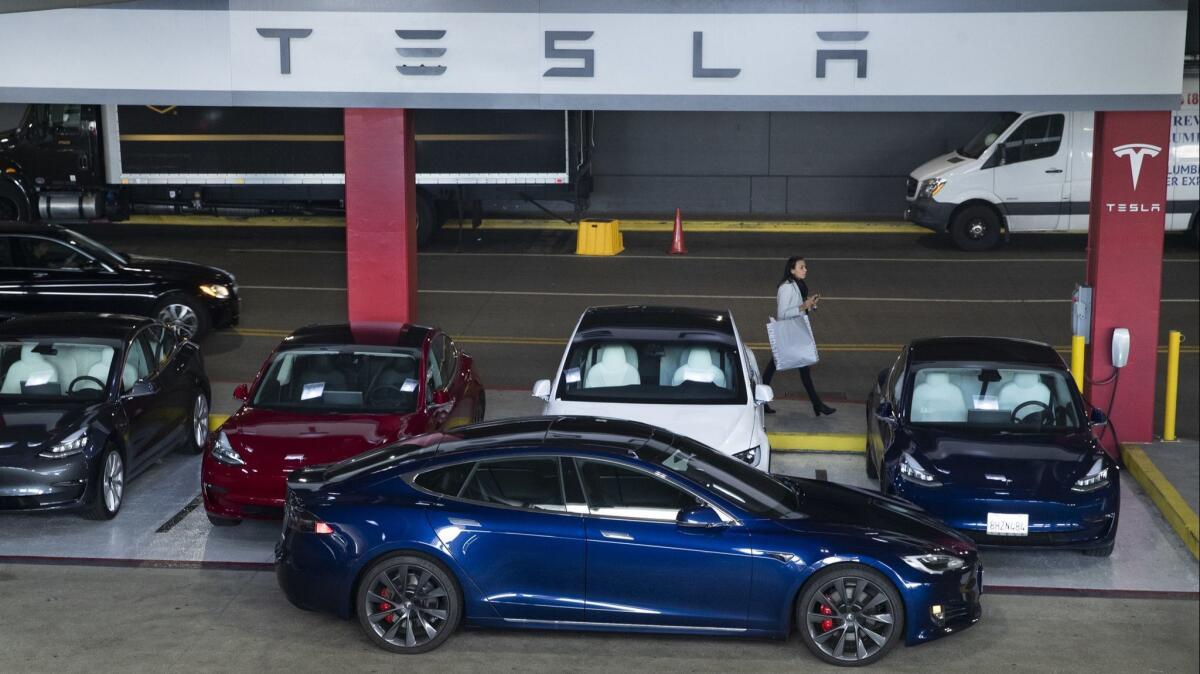 Tesla vehicles for sale in the parking garage of the Westfield Topanga shopping center in Canoga Park.