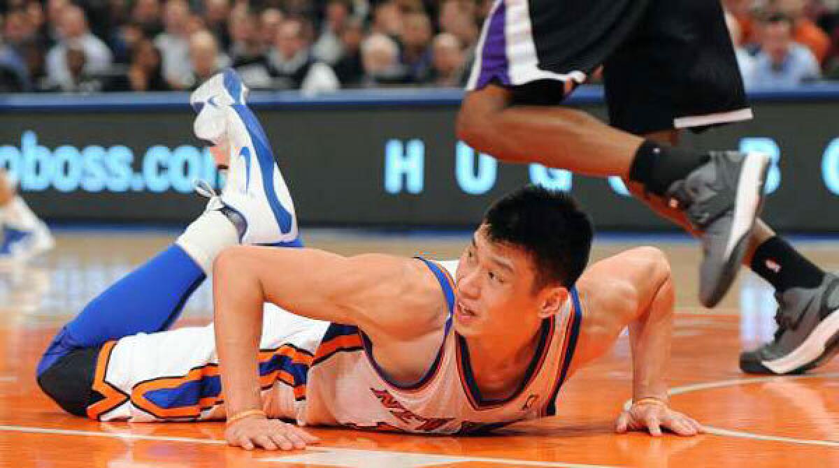 Jeremy Lin gets up after diving during the second half against the Sacramento Kings on Feb. 15.