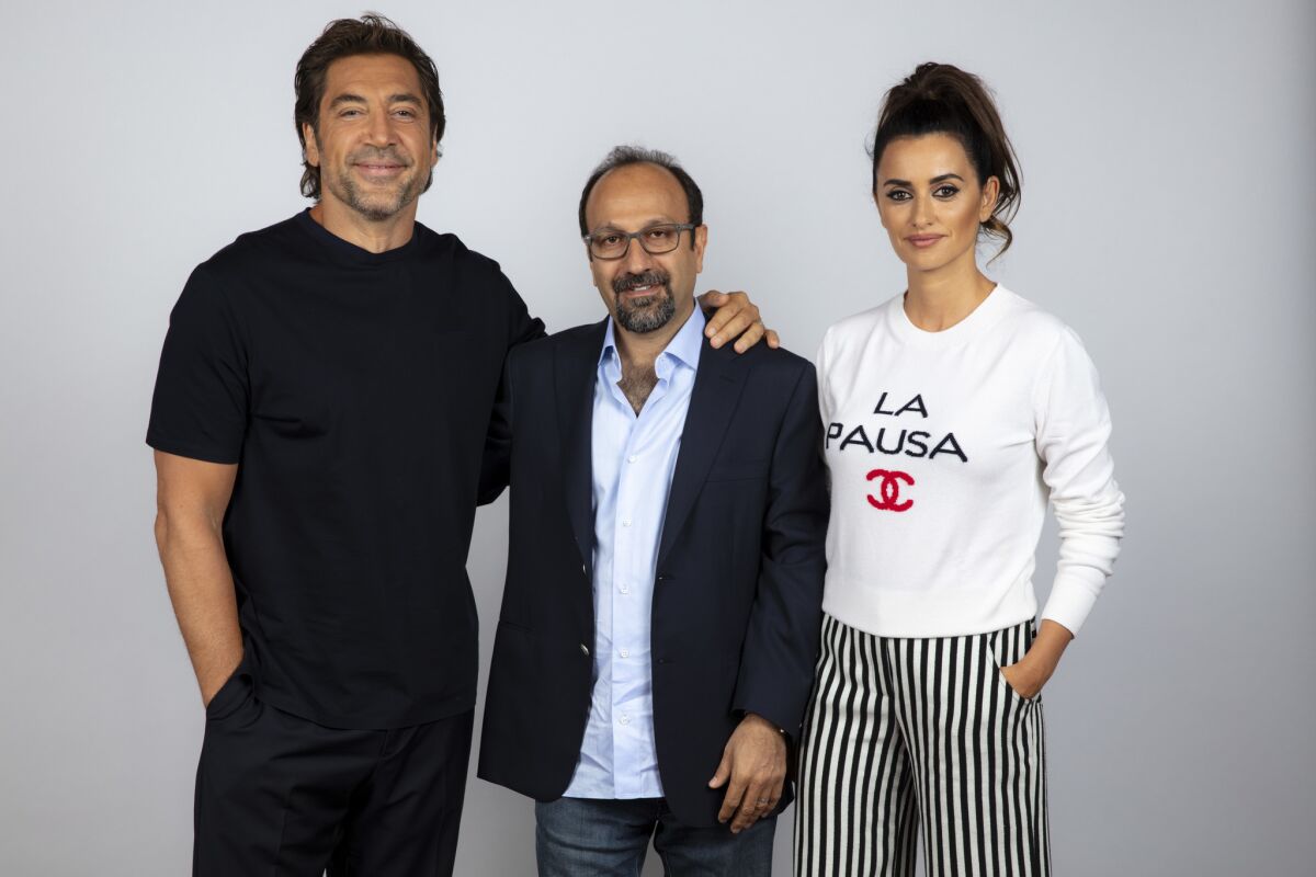 Actor Javier Bardem, left, director Asghar Farhadi and actress Penelope Cruz from the film "Everybody Knows."