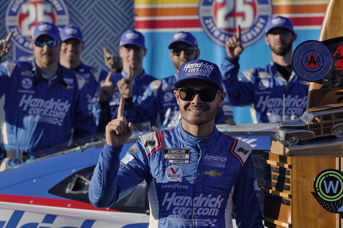 Kyle Larson celebrates after winning the NASCAR Cup Series auto race at Auto Club Speedway.