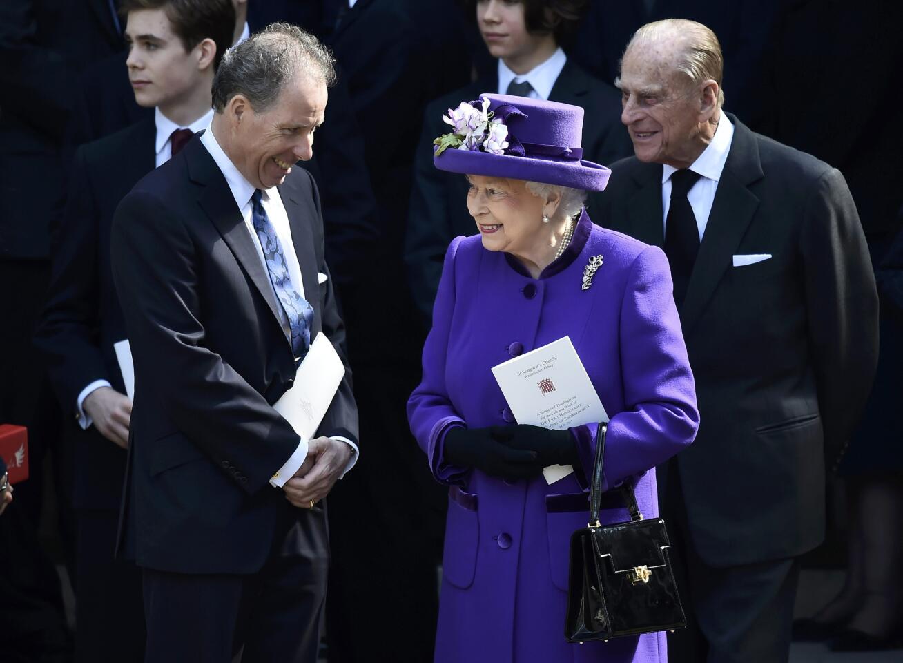David Armstrong-Jones, 2nd Earl of Snowdon and nephew of Queen Elizabeth II, speaks to her and Prince Philip as they leave a service honoring Lord Snowdon at Westminster Abbey on April 7.