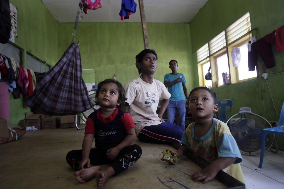 Rohingya migrants watching TV inside a temporary shelter in Bireun Bayeun, Aceh, Indonesia on April 28.