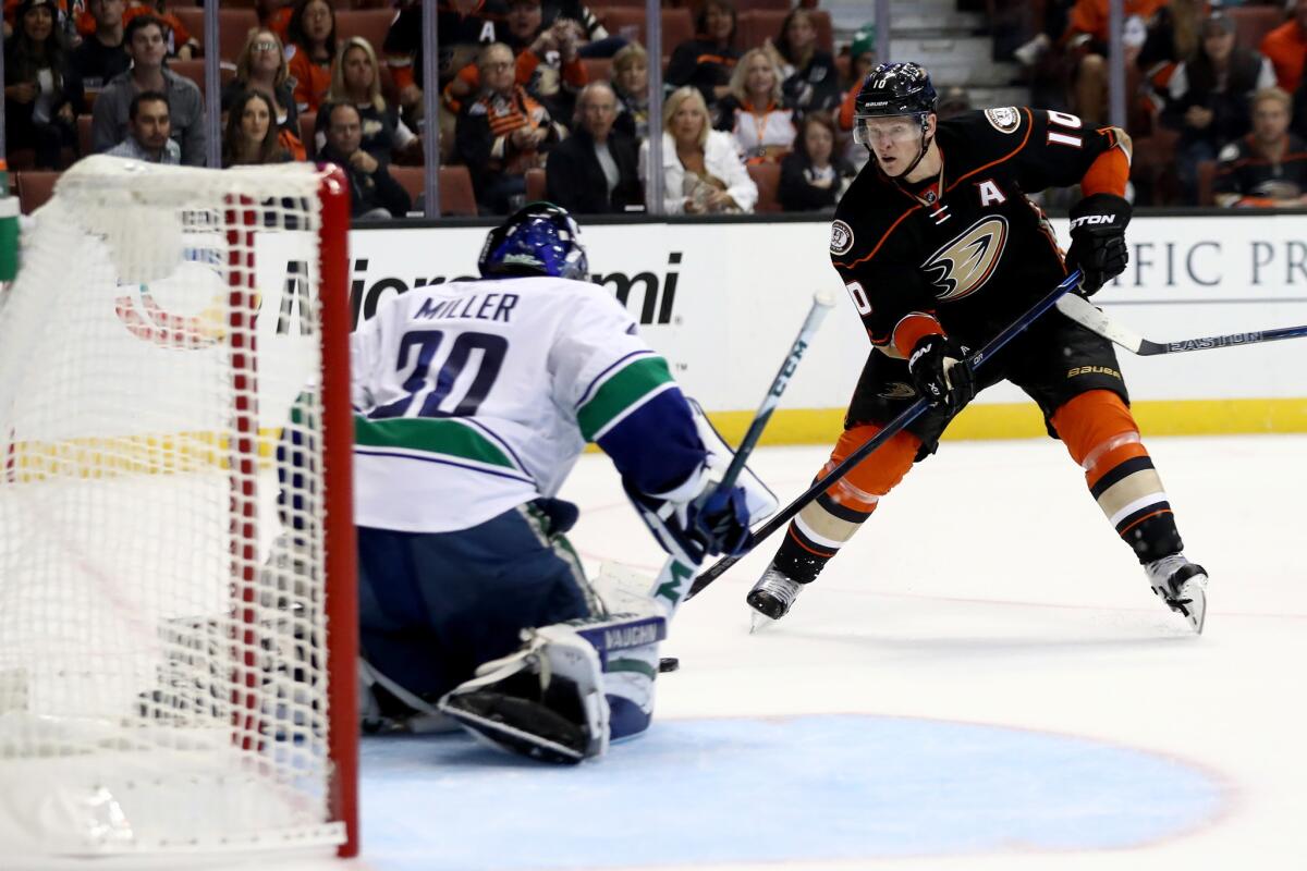 Ducks forward Corey Perry (10) shoots on goal against Canucks goalie Ryan Miller (30) during the third period on Oct. 23.