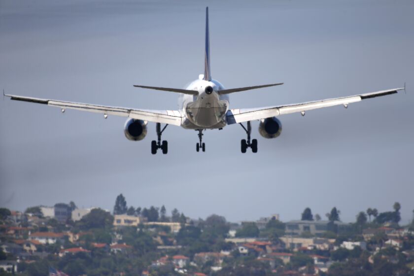 A United Airlines jet approaches San Diego International Airport for a landing on August 27, 2019.
