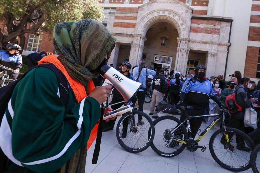 Westwood, CA - May 06: Pro-Palestinian supporters demonstrate in front of Dodd Hall after arrests at the Westwood campus of UCLA on Monday, May 6, 2024 in Westwood, CA. (Brian van der Brug / Los Angeles Times)