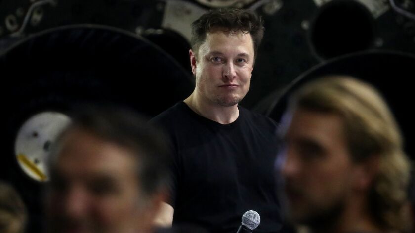SpaceX Chief Executive Elon Musk on Monday answers questions about his plan to send a Japanese private citizen around the moon. The U.S. Department of Justice opened an inquiry Tuesday into possible investor fraud.