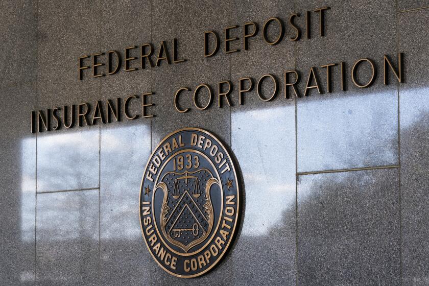 FILE - The Federal Deposit Insurance Corporation (FDIC) seal is shown outside its headquarters, March 14, 2023, in Washington. An independent review released Tuesday, May 7, 2024, of the Federal Deposit Insurance Corp. 's workplace culture describes an environment that fostered “hostile, abusive, unprofessional, or inappropriate conduct," and questions whether the agency's chairman is credible to lead the agency through a cultural transformation. (AP Photo/Manuel Balce Ceneta, File)