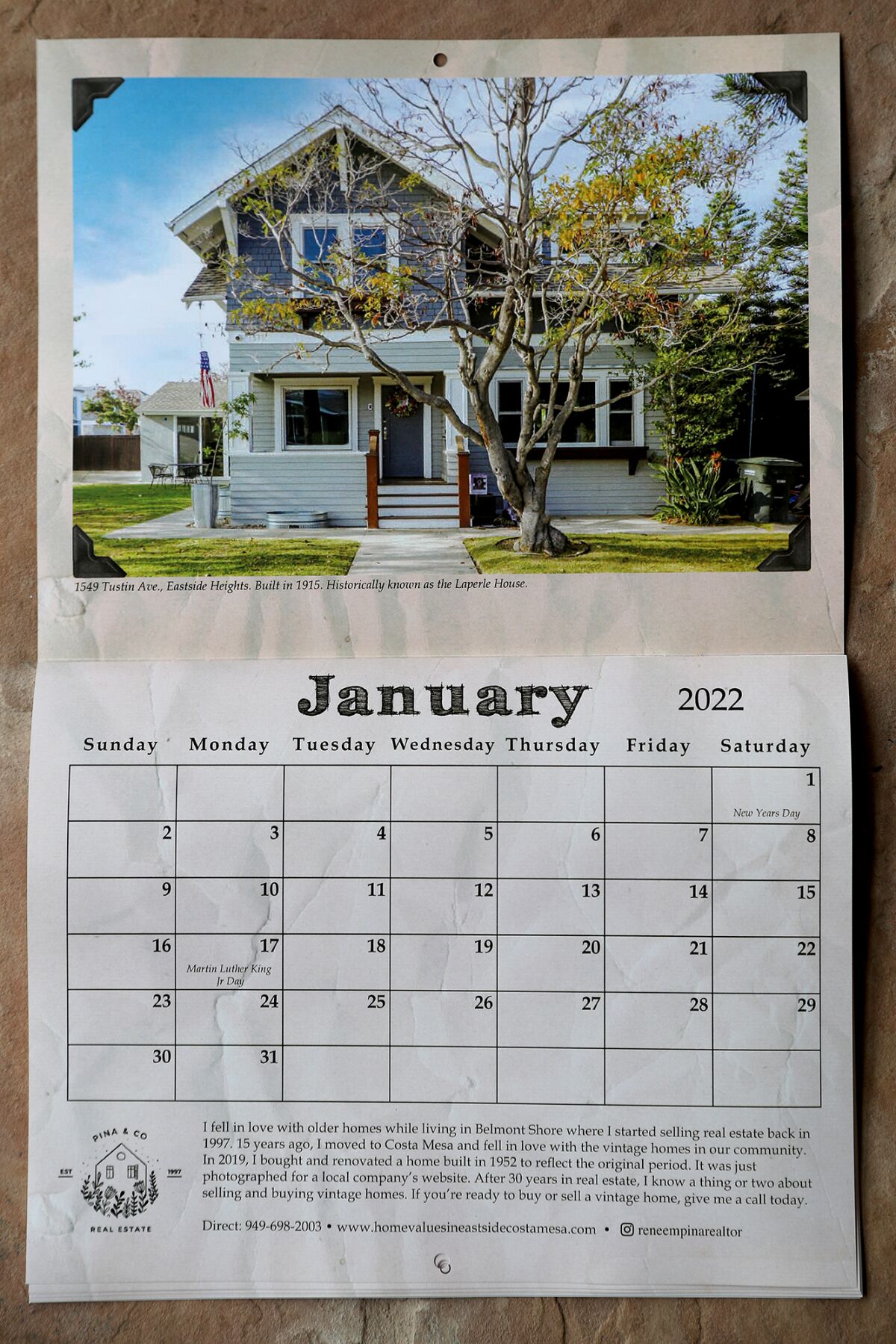 The month of January shows a photo of an Eastside Heights home, built in 1915, along Tustin Avenue in Costa Mesa.