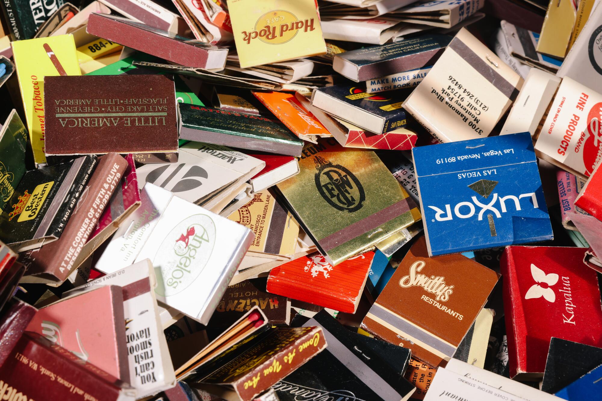 Matchbooks fill a box during an Angelus Matchcover club meeting.