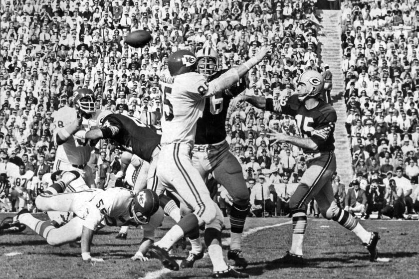 Green Bay Packers quarterback Bart Starr throws a pass to Elijah Pitts during the first quarter of Super Bowl I against the Kansas City Chiefs on Jan. 15, 1967.