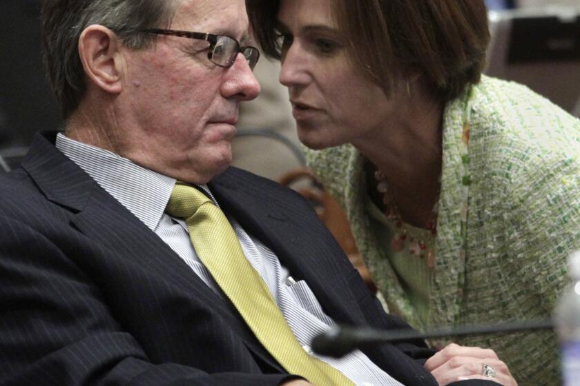 Republican state Sens. Tom Berryhill (R-Modesto) and Mimi Walters (R-Lake Forest)confer during a recent floor debate on the budget. Berryhill faces administrative charges of laundering campaign contributions to his brother.
