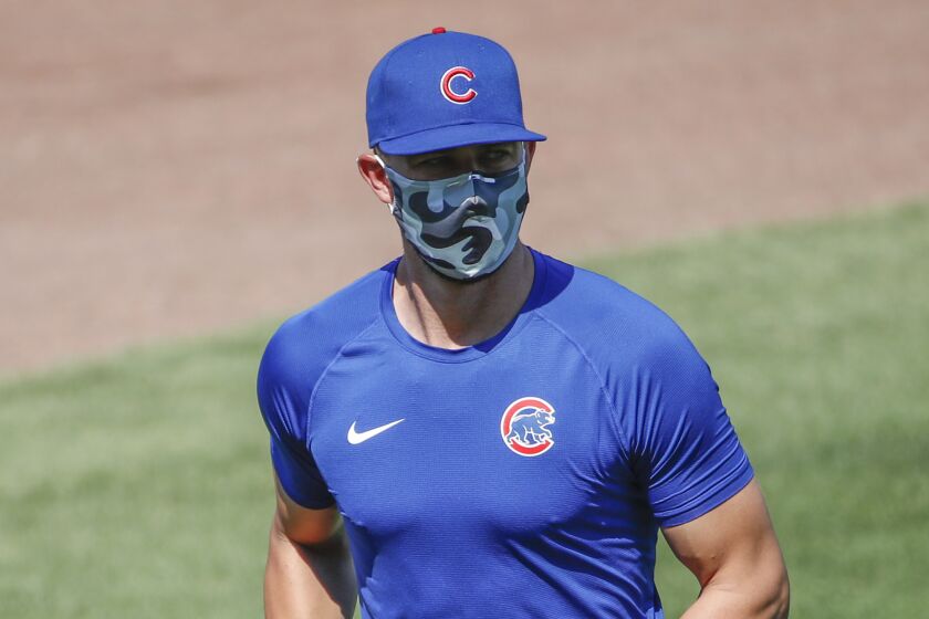 Chicago Cubs third baseman Kris Bryant warms up during baseball practice.