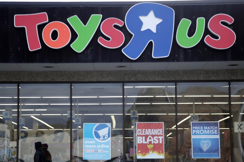 FILE- This Jan. 24, 2018, file photo shows a person walking near the entrance to a Toys R Us store, in Wayne, N.J. Canadaâs Fairfax Financial Holding has placed a bid of $300 million to buy Toys R Usâs Canadian operations in bankruptcy. According to court papers filed late Thursday, April 19, 2018, the bidder is taking on a role of a âstalking horseâ in a court-approved auction set for Monday in New York. That means it could be outbid in the auction if other buyers come in with a higher offer. The bid from Fairfax surpassed the $215 million offer that Isaac Larian, the CEO of privately held toy company MGA Entertainment, made last week. (AP Photo/Julio Cortez, File)
