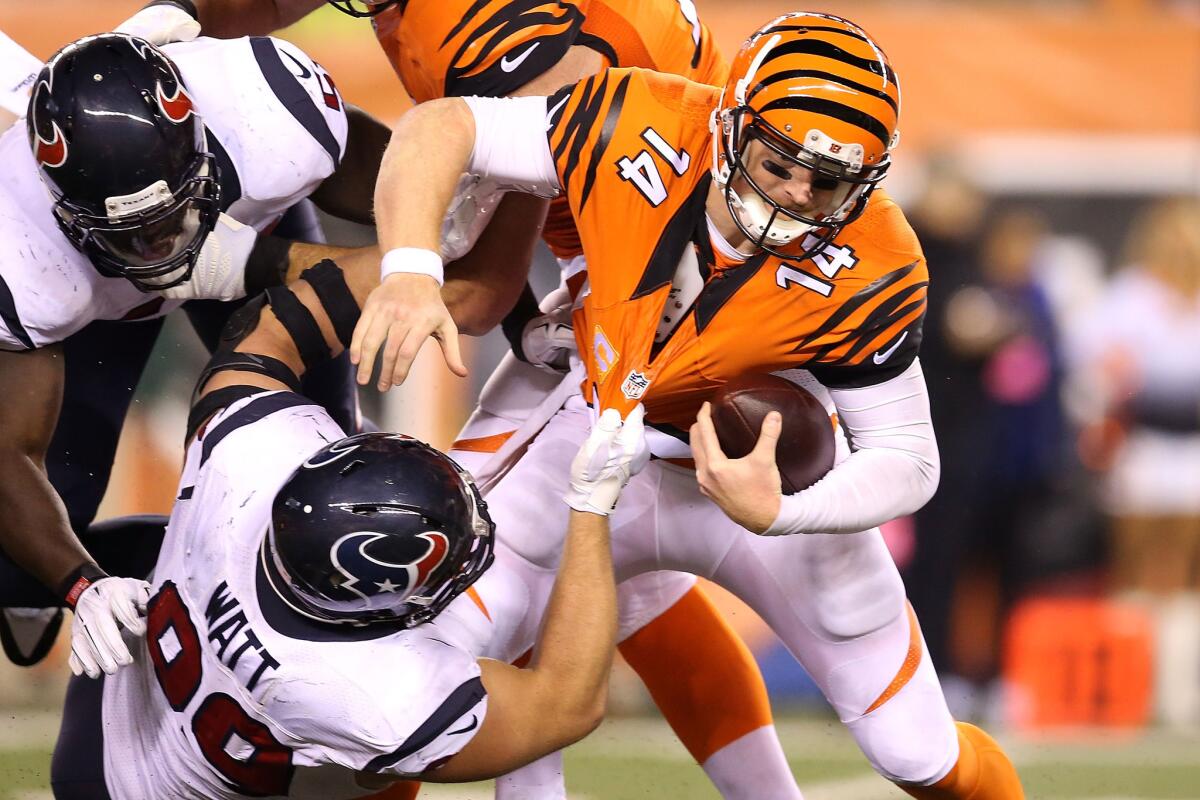 CINCINNATI, OH - NOVEMBER 16: J.J. Watt #99 of the Houston Texans sacks Andy Dalton #14 of the Cincinnati Bengals during the fourth quarter at Paul Brown Stadium on November 16, 2015 in Cincinnati, Ohio. Houston defeated Cincinnati 10-6. (Photo by Andy Lyons/Getty Images) ** OUTS - ELSENT, FPG, CM - OUTS * NM, PH, VA if sourced by CT, LA or MoD **