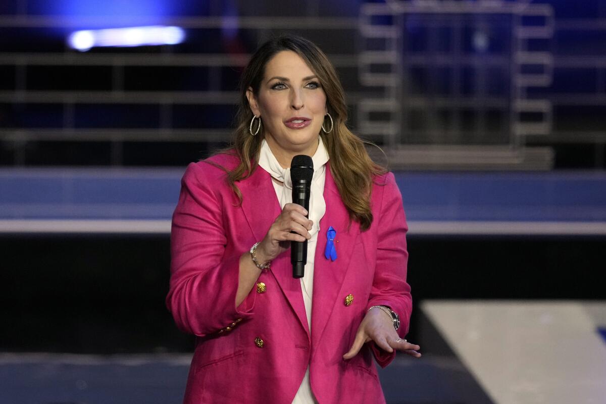 Republican National Committee Chair Ronna McDaniel speaks into a microphone.