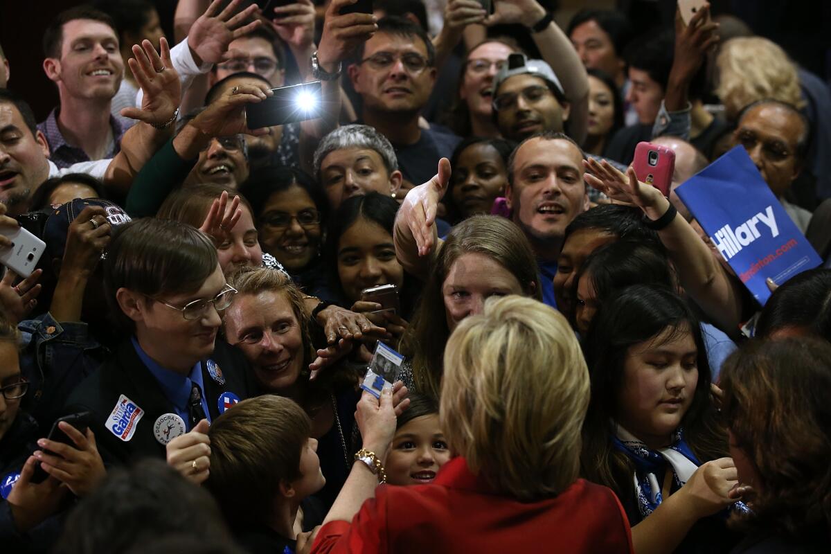 Democratic presidential candidate Hillary Clinton greets supporters during a campaign rally at Texas Southern University on Feb. 20, hours after defeating Sen Bernie Sanders in the Nevada Democratic caucuses.