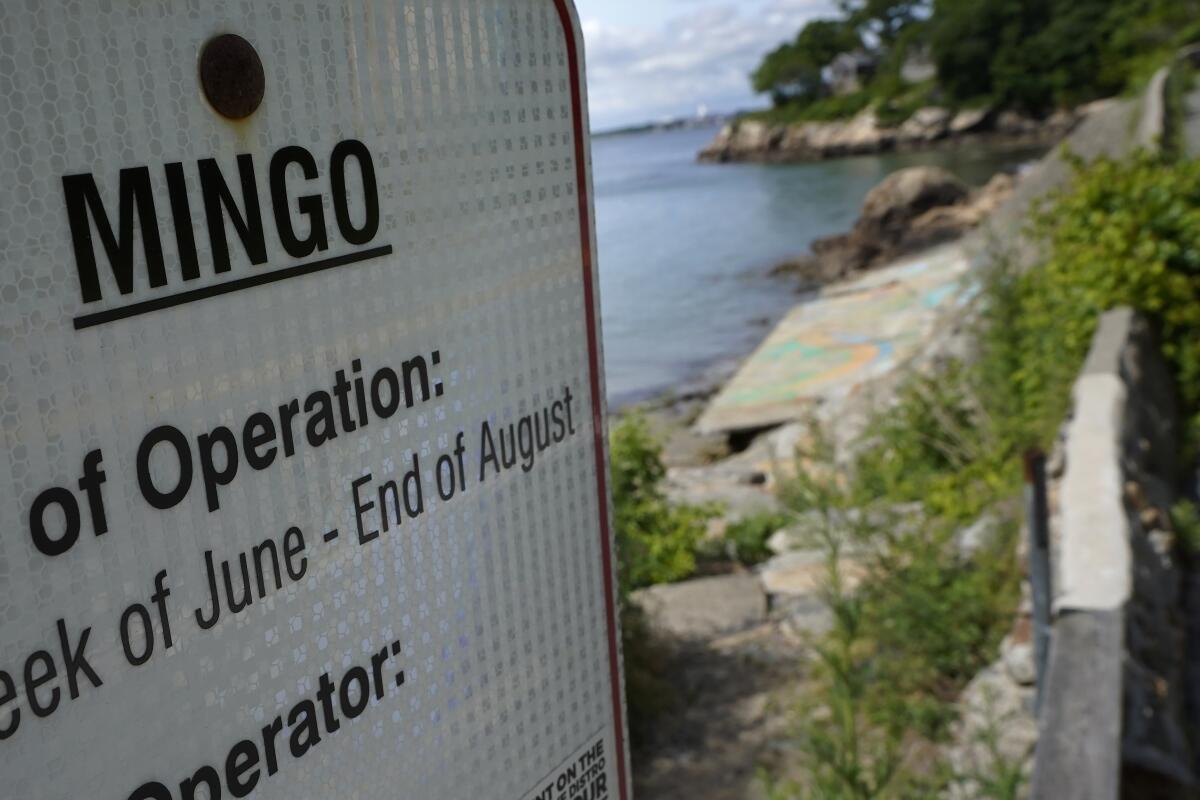 An advisory lists the name Mingo on a sign at an entrance to Mingo Beach, in Beverly, Mass.