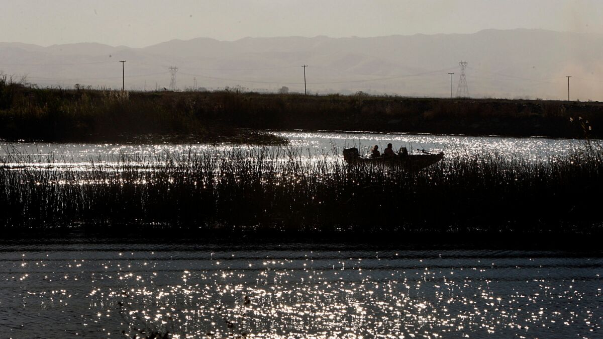 Boaters navigate the Middle River in the Sacramento River Delta in 2010.
