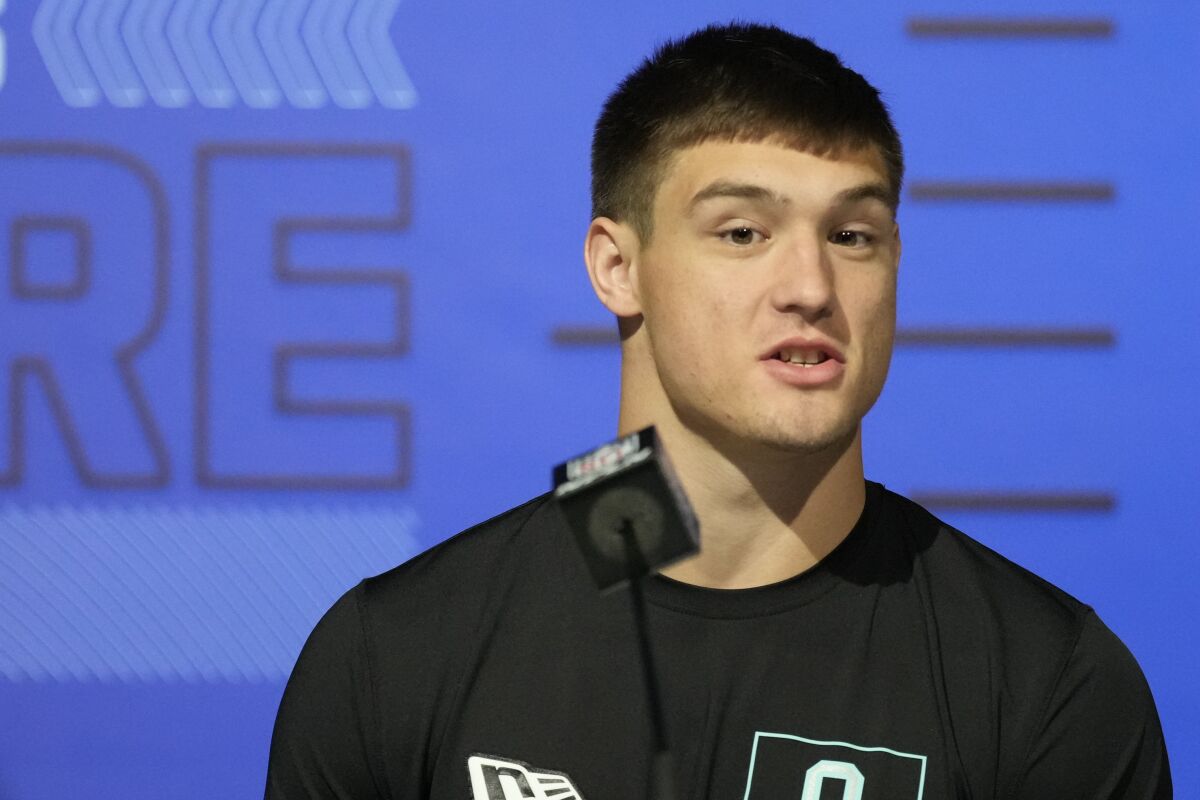 Wisconsin linebacker Leo Chenal speaks during a press conference at the NFL football scouting combine in Indianapolis, Friday, March 4, 2022. (AP Photo/AJ Mast)