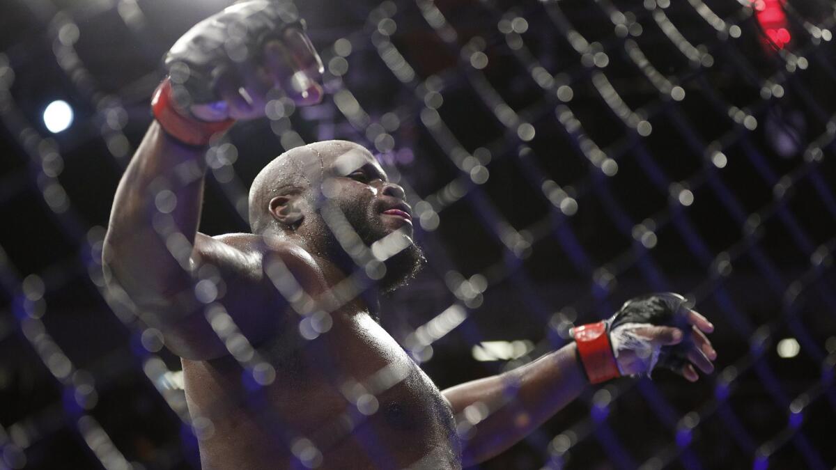 Derrick Lewis celebrates after beating Alexander Volkov during a heavyweight mixed martial arts bout at UFC 229 in Las Vegas on Oct 6. Lewis won by knockout in the third round.