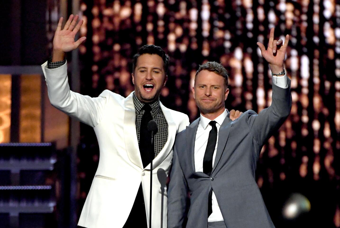 Cohosts Luke Bryan and Dierks Bentley greet the crowd from onstage during the 52nd Academy of Country Music Awards at T-Mobile Arena in Las Vegas.