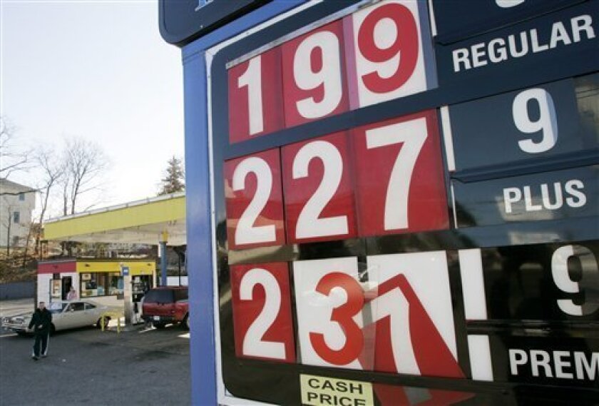 Gas prices at a filling station in Dedham, Mass., appear on display Wednesday, Nov. 12, 2008. Oil prices dropped below $57 a barrel Wednesday as a Bank of England warning about the risk of deflation stoked fears of stagnating global growth. (AP Photo/Steven Senne)