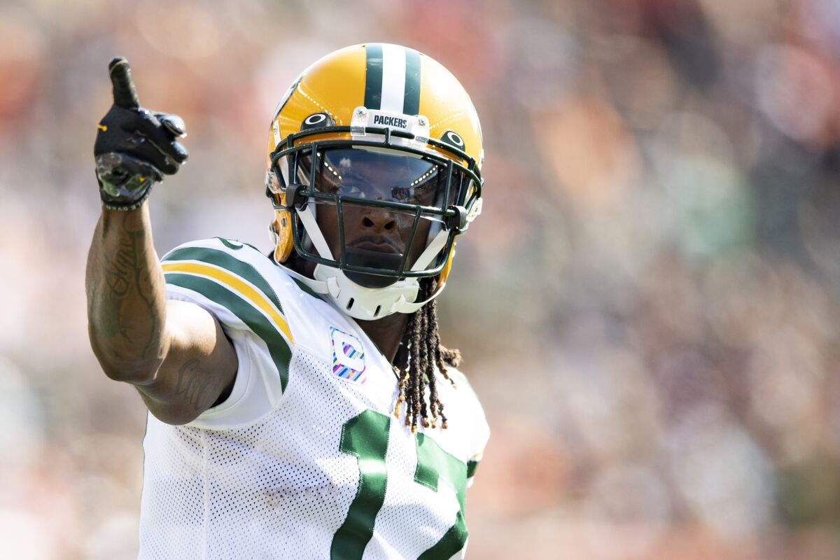 Green Bay Packers wide receiver Davante Adams (17) reacts during an NFL football game against the Cincinnati Bengals, Sunday, Oct. 10, 2021, in Cincinnati. Adams is on pace to accumulate more catches and yards receiving than he did last year while earning All-Pro honors. (AP Photo/Emilee Chinn)