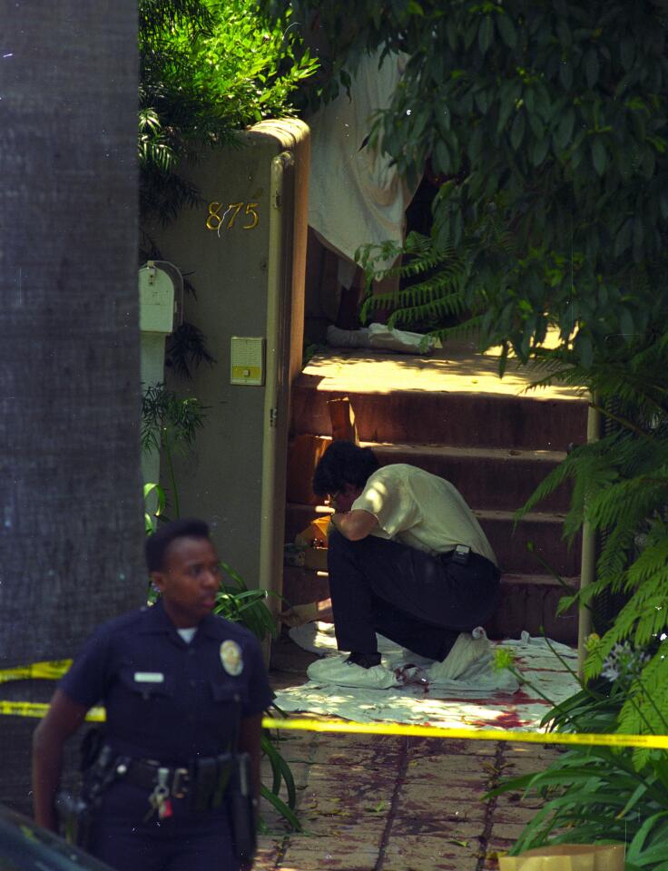 Nicole Brown Simpson's body was found outside her home at 875 S. Bundy Drive in Brentwood. Police examine the area where her body was found.