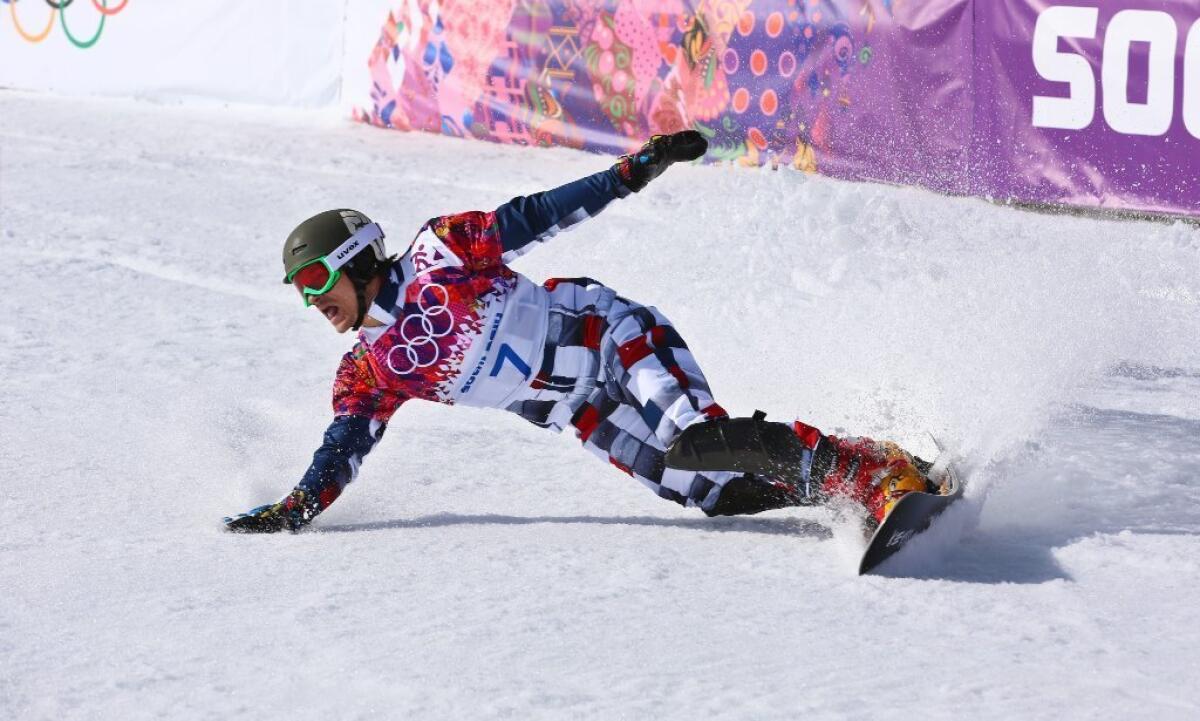 Vic Wild comes to a stop after winning a gold medal at the Sochi Olympics.