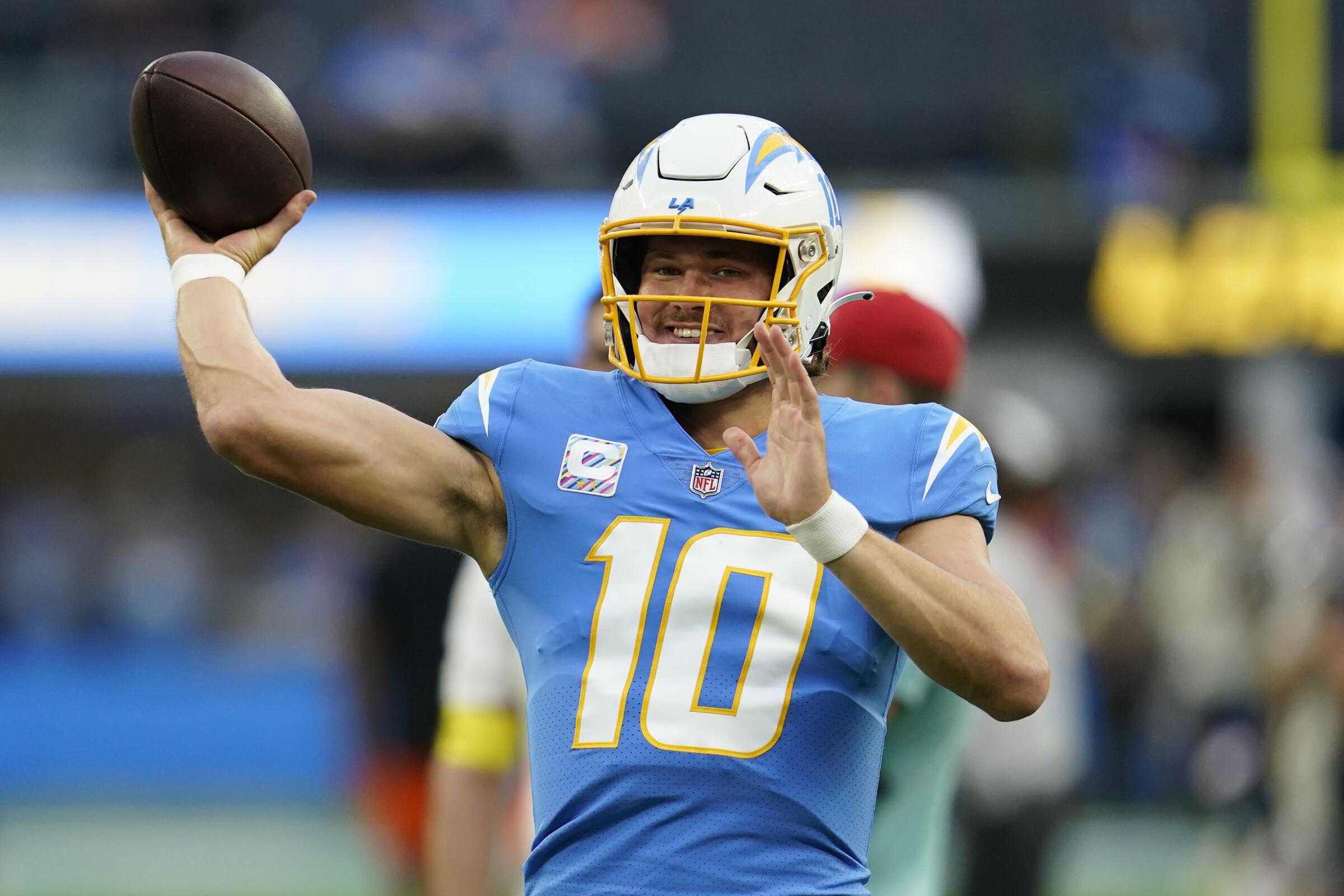 Chargers quarterback Justin Herbert warms up before a win over the Denver Broncos on Monday night.