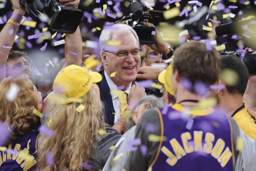 LOS ANGELES, CA – JUNE17, 2010 ––Phil Jackson celebrates with fans after Lakers defeated the Celtics to win the NBA Championship in game 7 of the NBA Finals at Staples