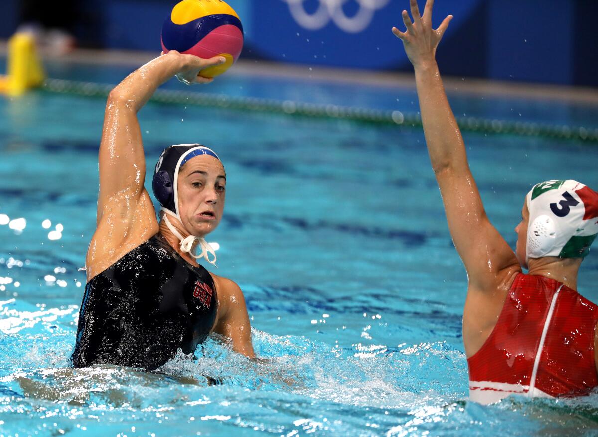 U.S. attacker Maggie Steffens, left, passes in front of Hungary's Vanda Valyi.