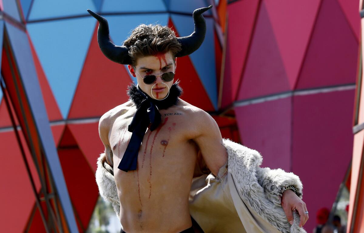 San Diego resident Connor Jerome Giedymin struts his style on day three of the Coachella Music And Arts Festival. (Luis Sinco / Los Angeles Times)