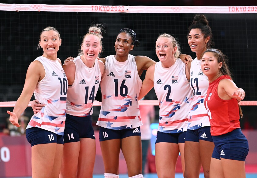 Justine Wong-Orantes and volleyball teammates celebrate a win at the Tokyo Olympics