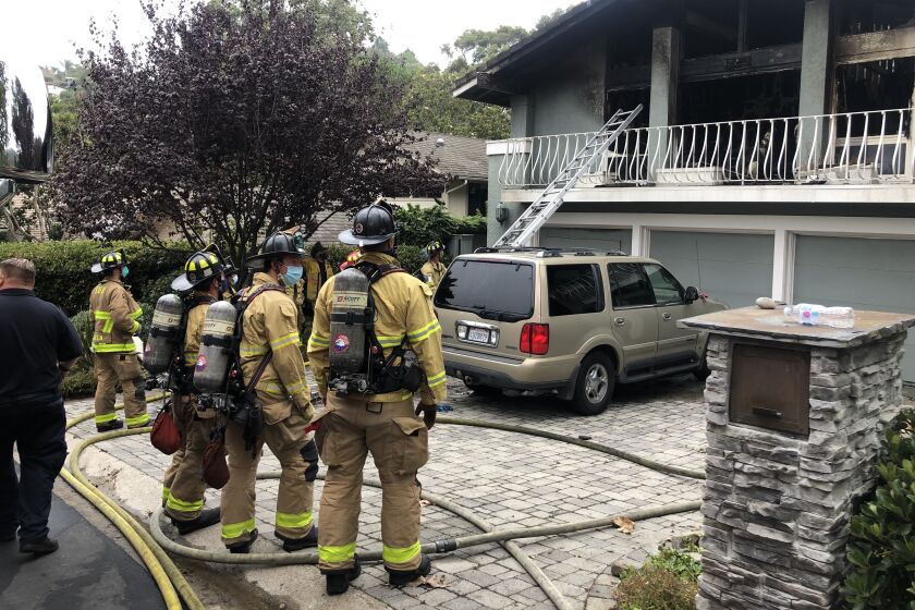 The bodies of two people were discovered inside a La Jolla home that caught fire early Monday morning.