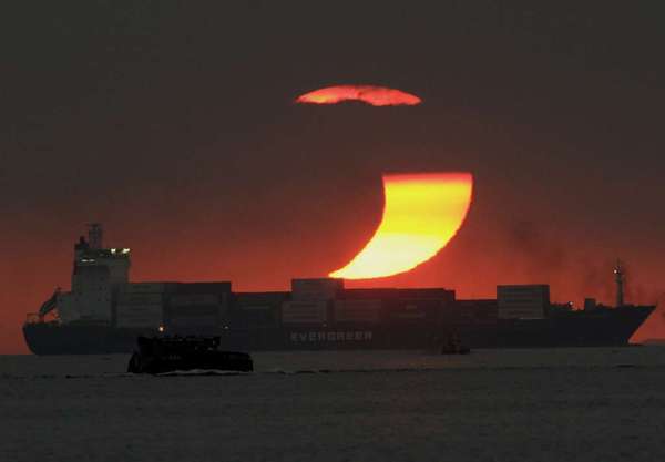 This 2009 partial eclipse of the sun occurred at sunset off the Philippines.