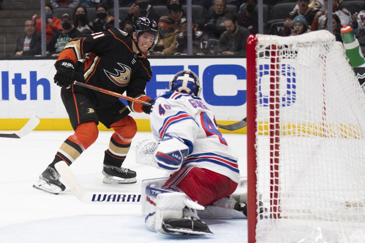Ducks forward Isac Lundestrom scores past New York Rangers goaltender Alexandar Georgiev.