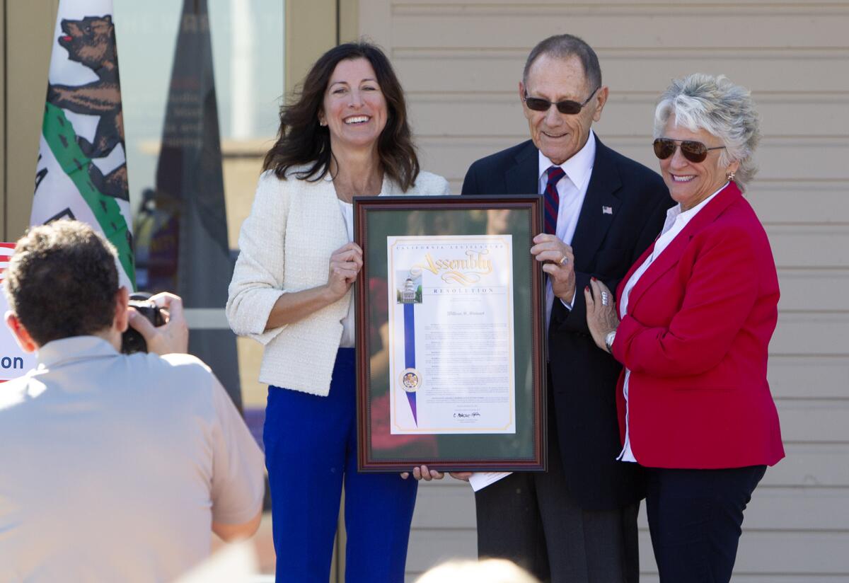 Honoree William "Bill" Stewart (Army Air Corps) receives recognition Friday from Assemblywoman Cottie Petrie-Norris, left, and Newport Beach Councilwoman Joy Brenner at the Heroes Hall veterans museum in Costa Mesa.