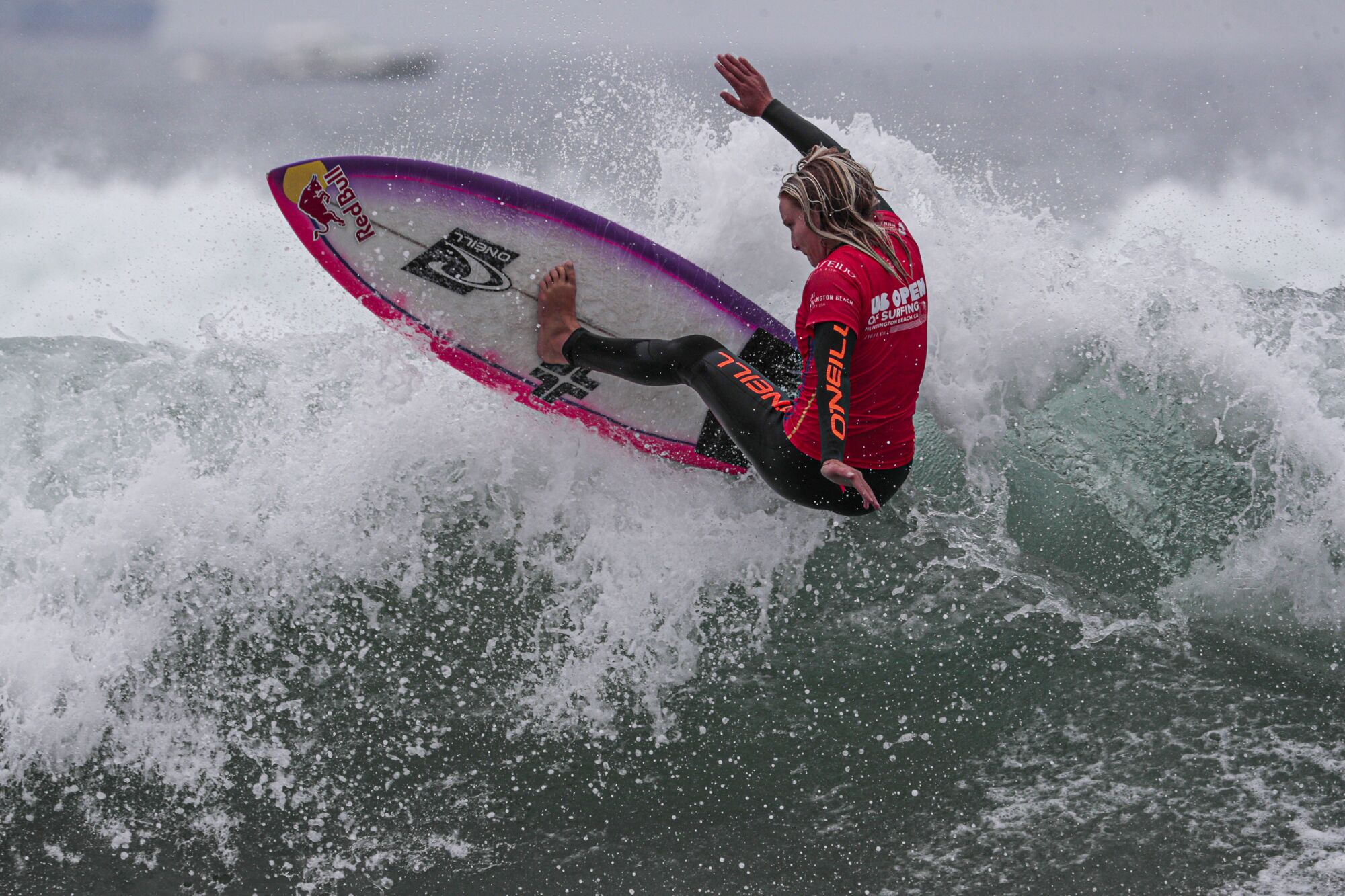 Caity Simmers competes in a preliminary heat to qualify for the final of the U.S. Open of Surfing