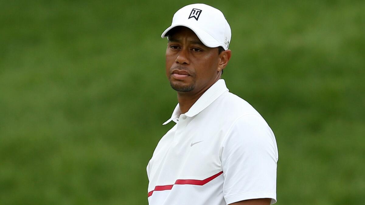 Tiger Woods reacts after missing a birdie putt on the 16th green during the third round of the Memorial on June 6, 2015.