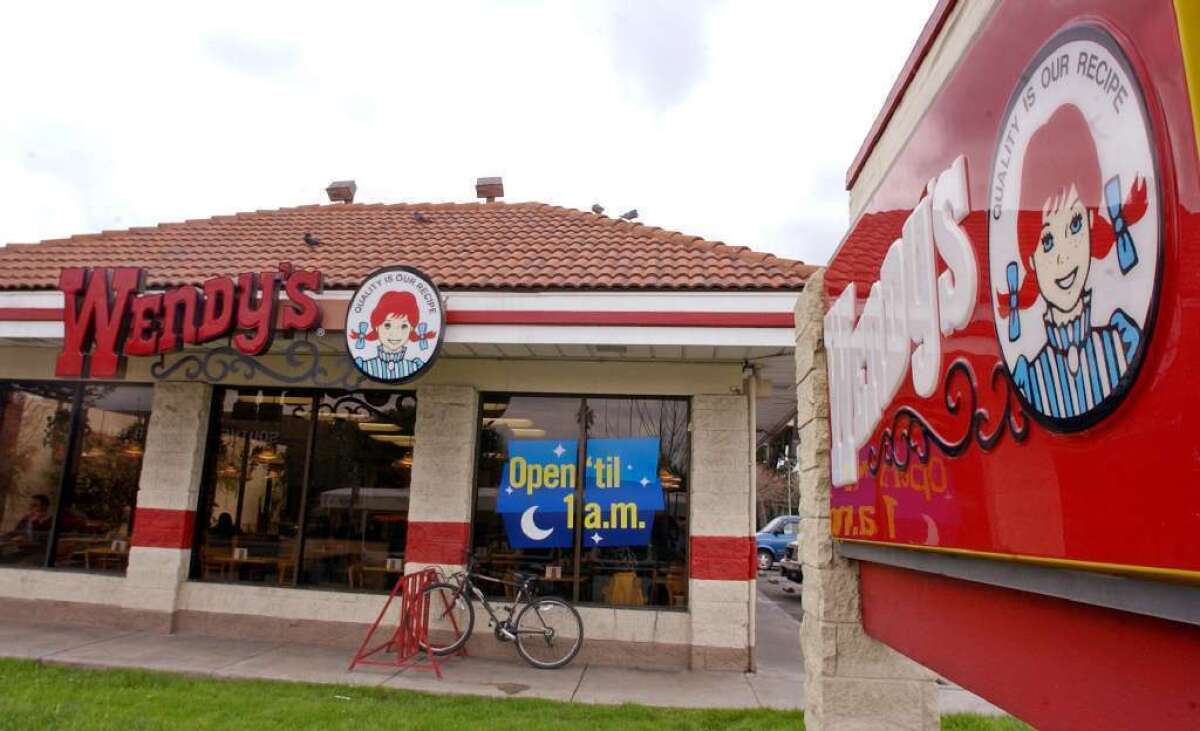 Some Wendy's locations now feature fireplaces and faux leather lounge chairs.